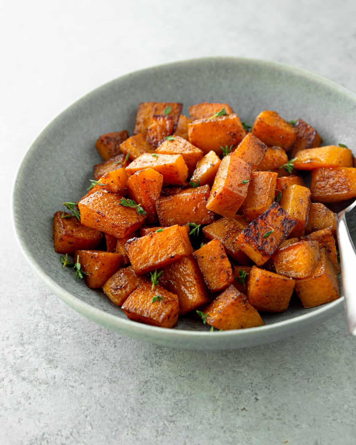 roasted butternut squash in a white bowl