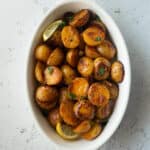 roasted potatoes in a white baking dish