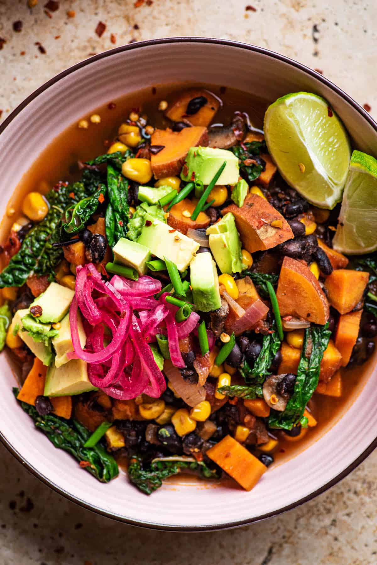 black bean and sweet potato chili in a pink bowl