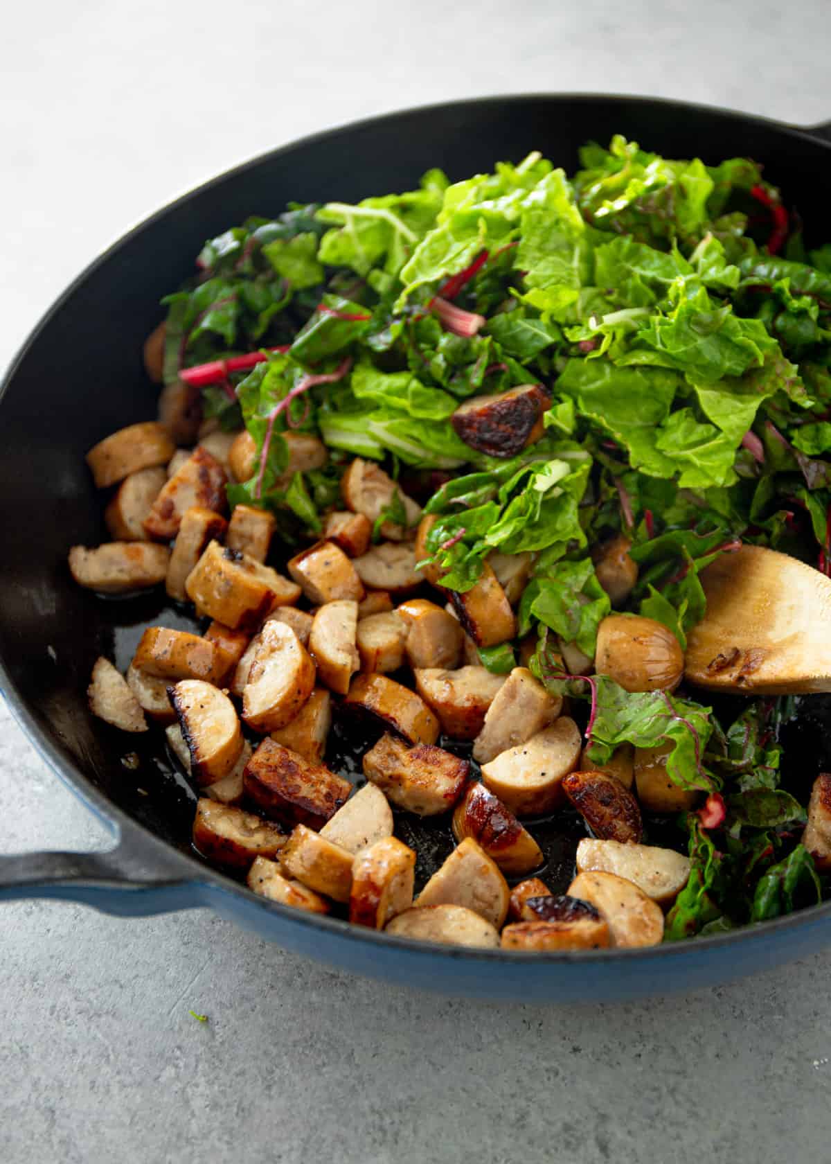 stirring chard into sweet potato hash 