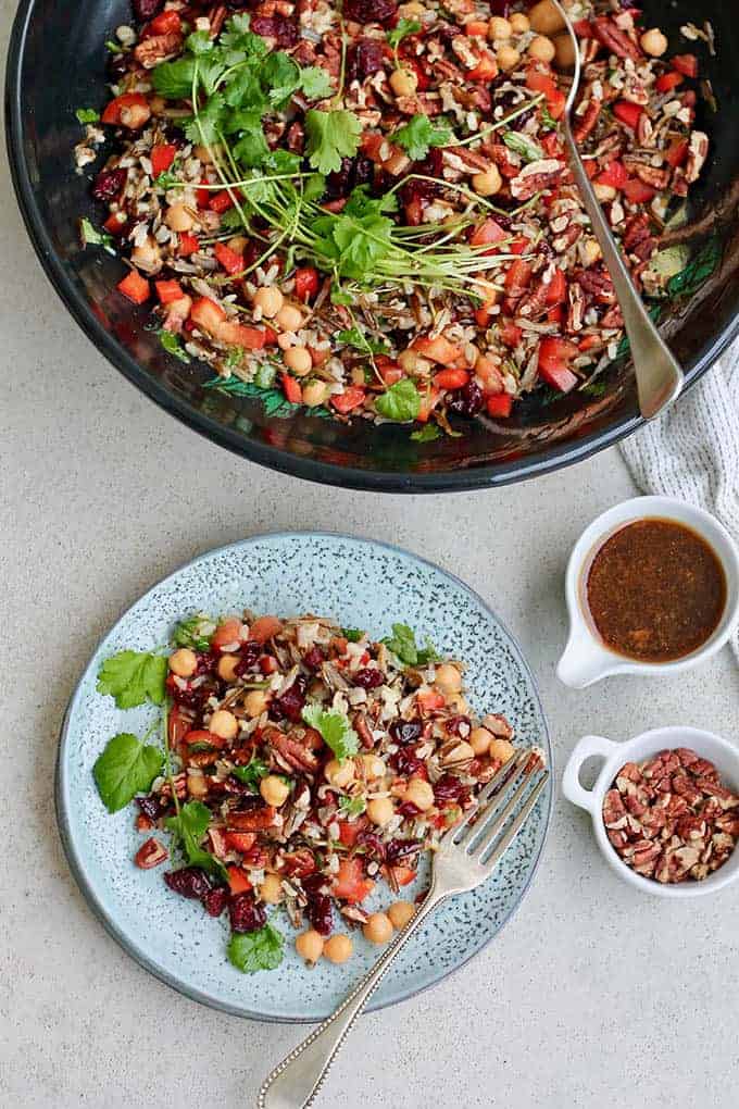 wild rice salad in a black bowl