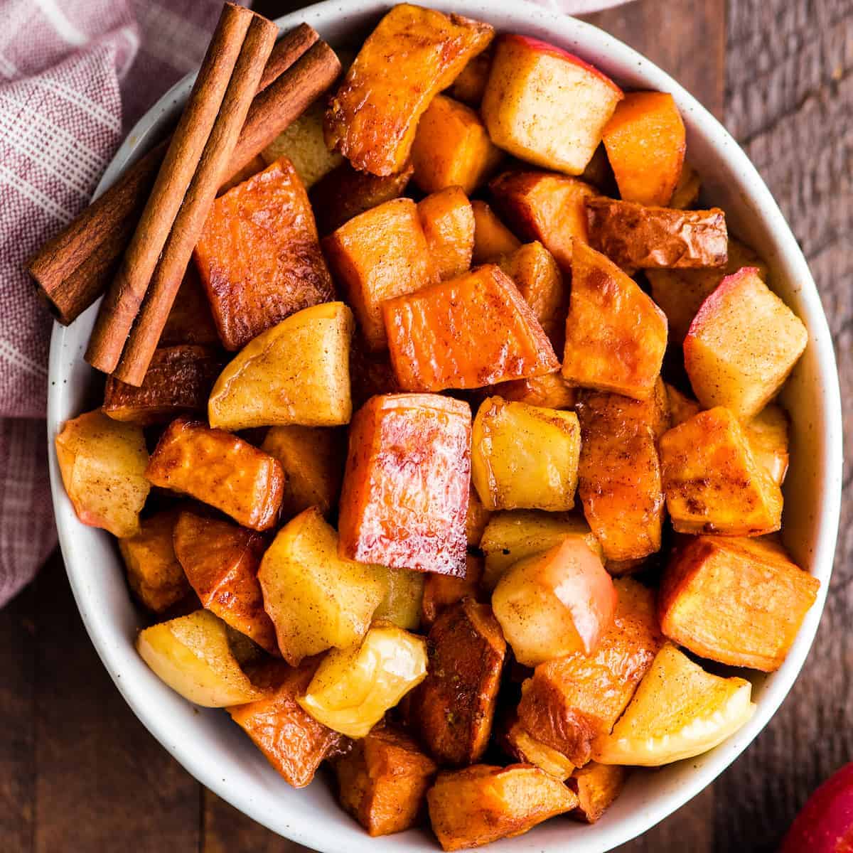 roasted sweet potatoes and apples in a white bowl