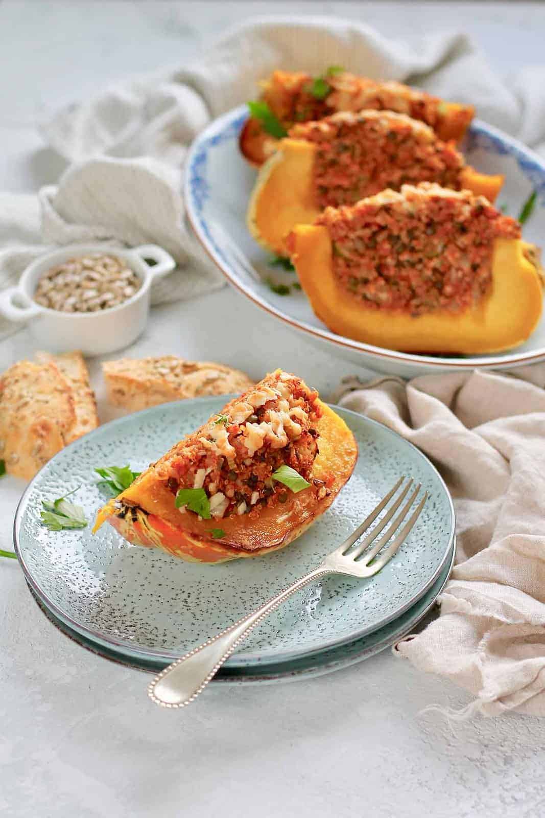 stuffed acorn squash on blue plates