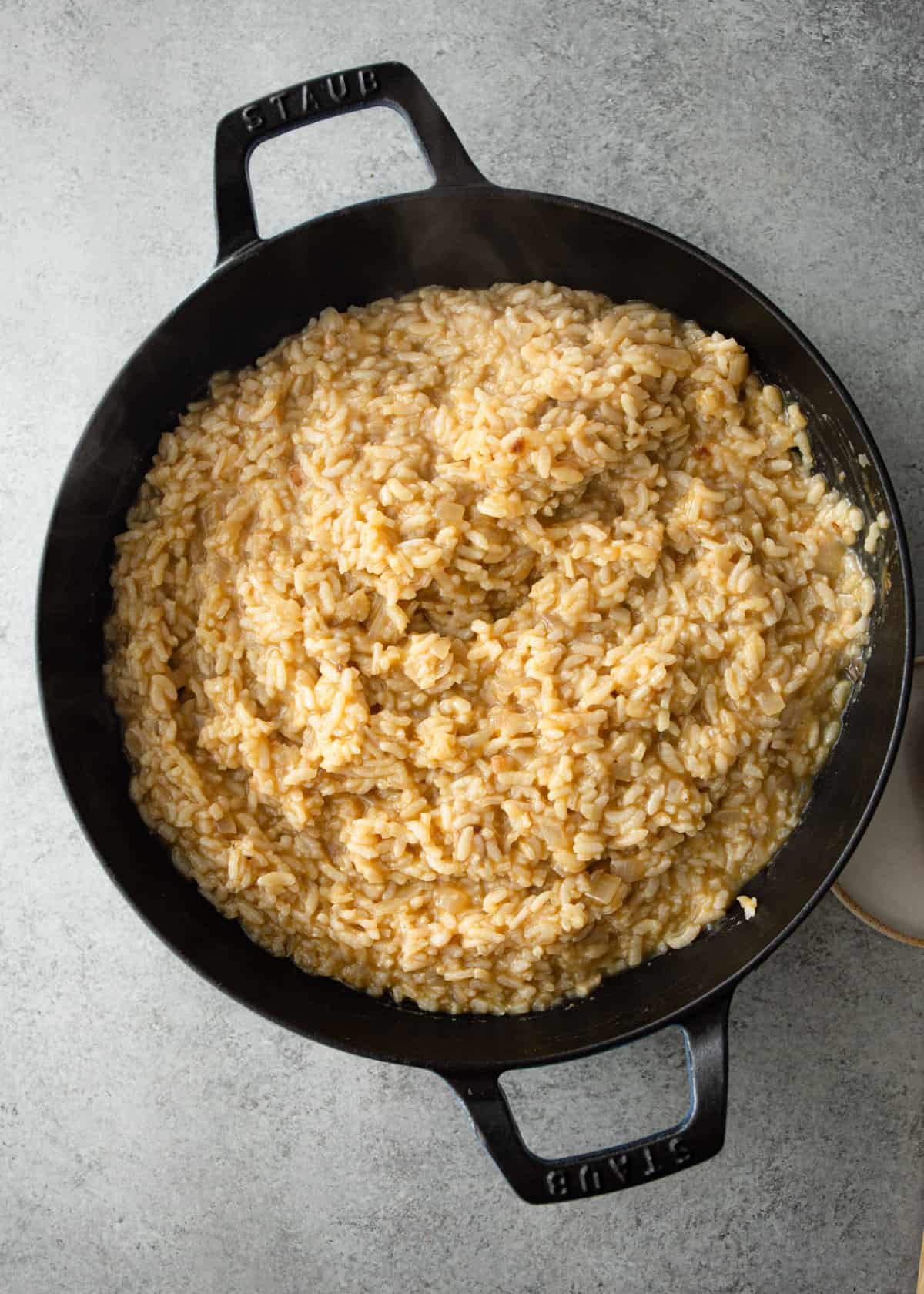 cooked rice in a cast iron skillet