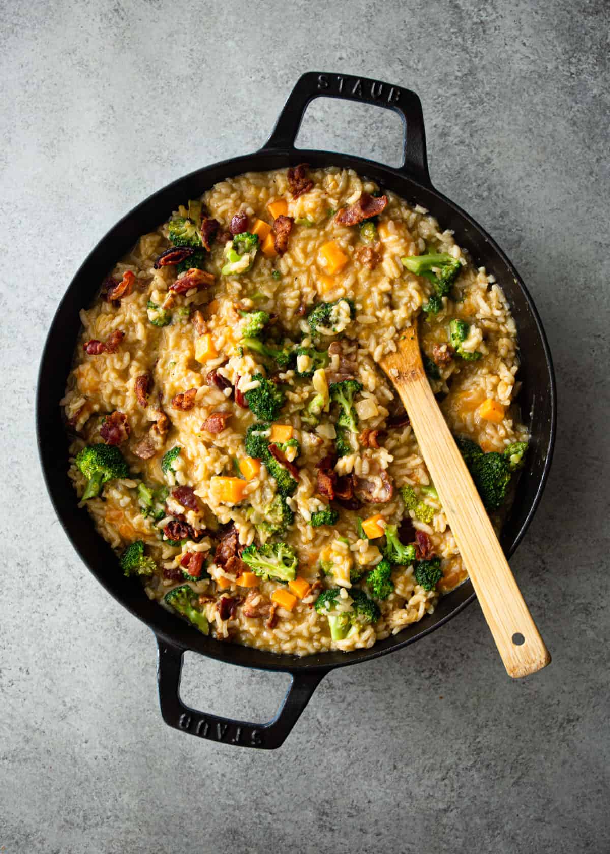 stirring risotto in a dutch oven