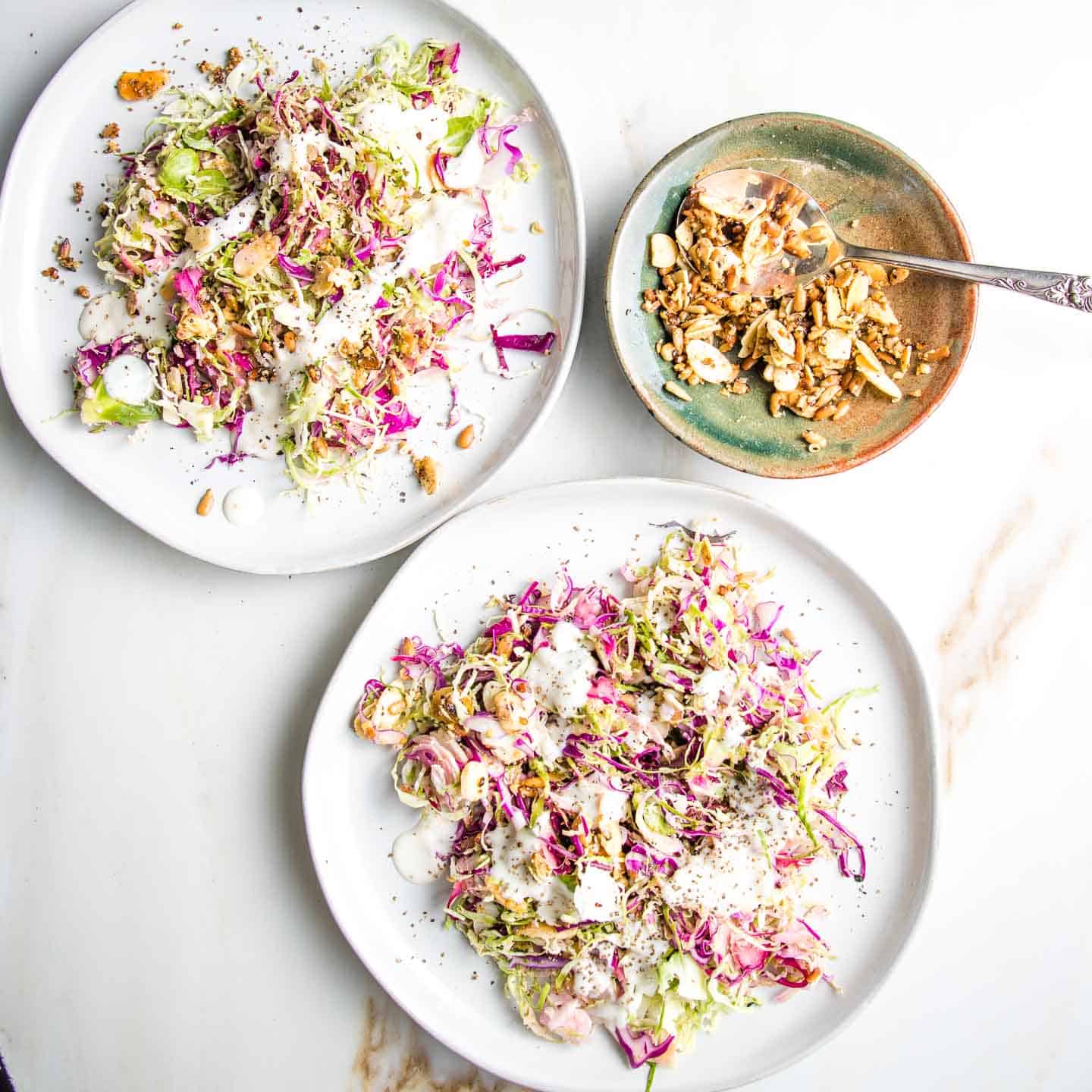 brussels sprouts salad on white plates