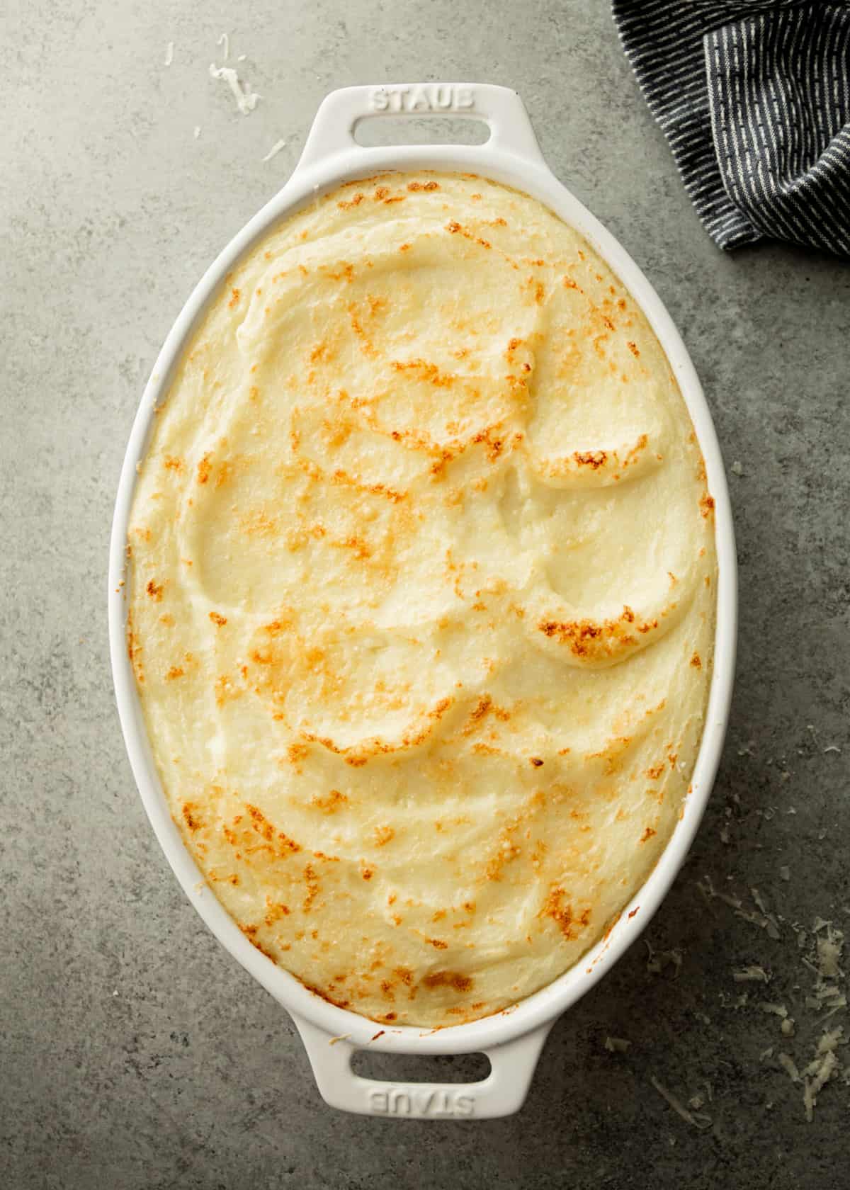mashed potatoes in a white oval baking dish