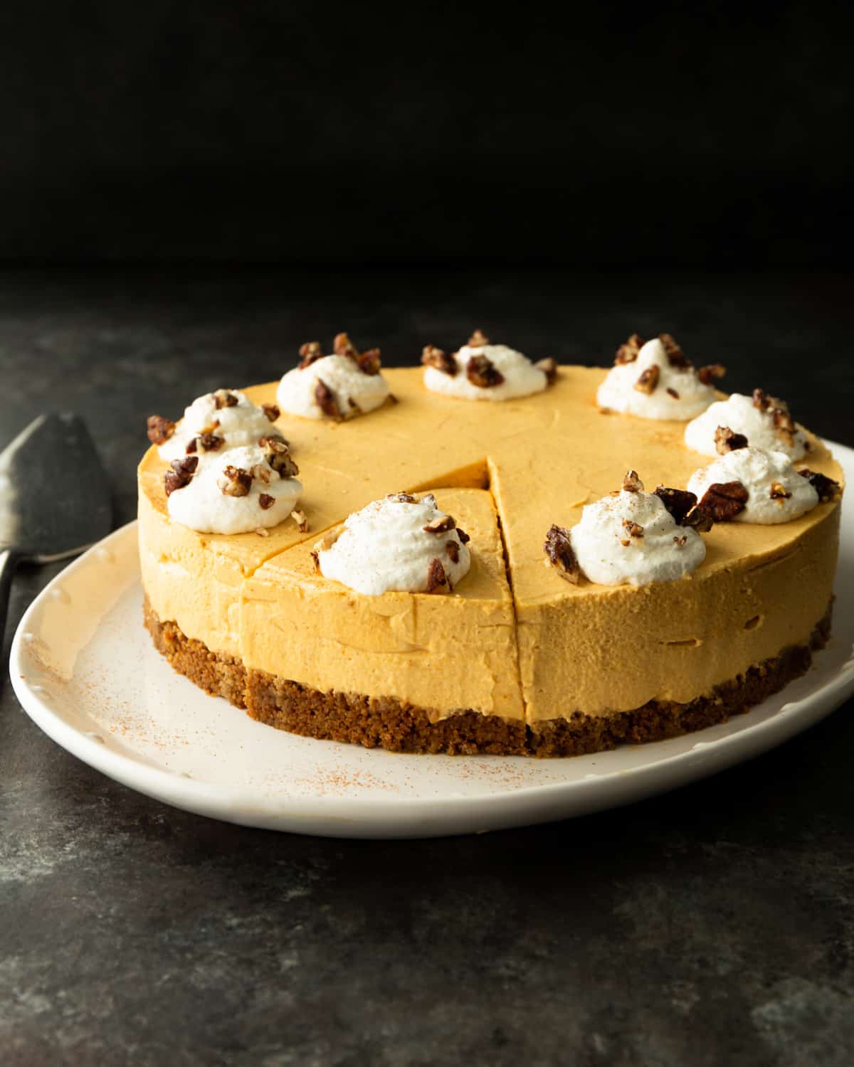 a pumpkin cheesecake on a white tray