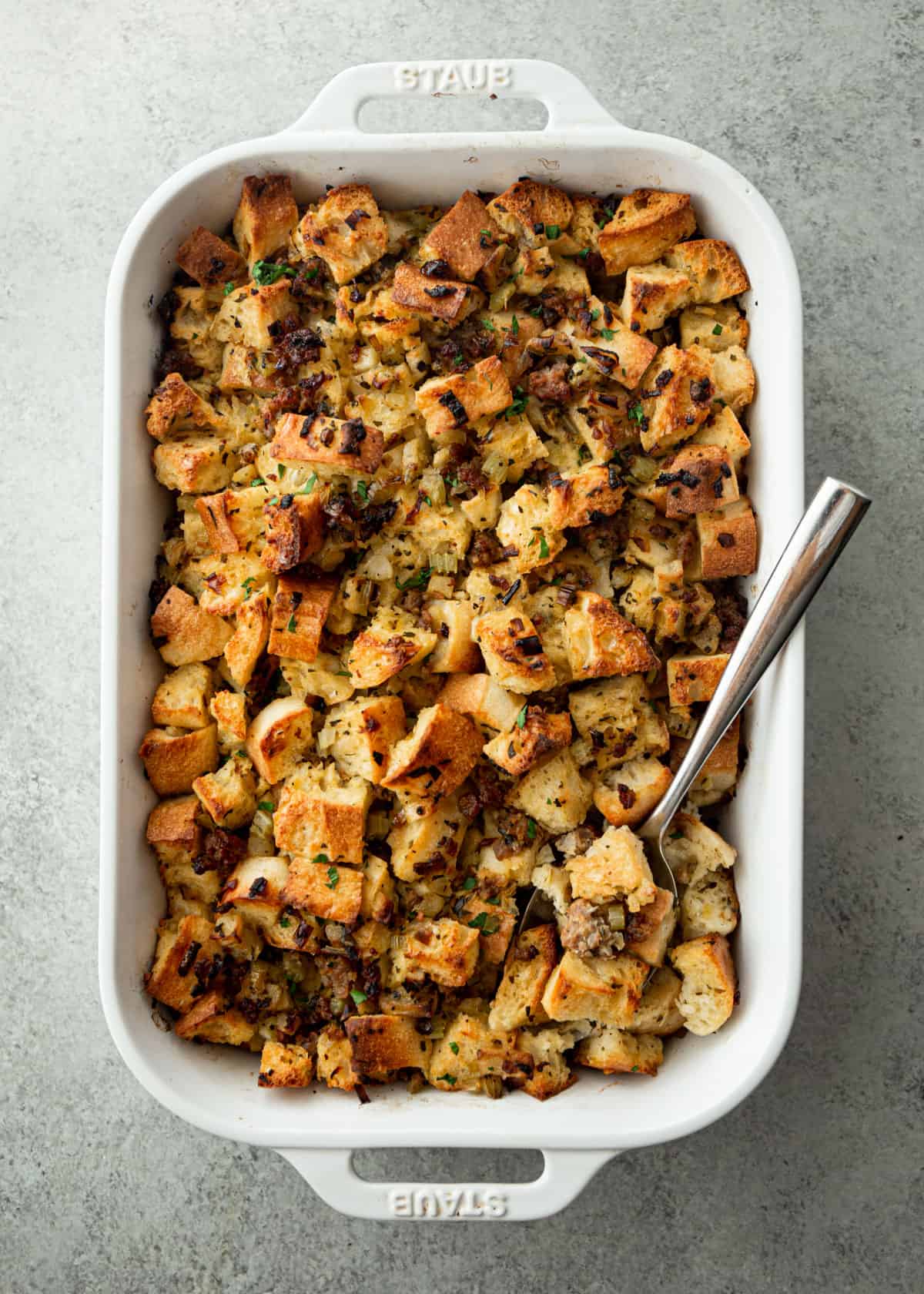 stuffing in a white rectangular baking dish