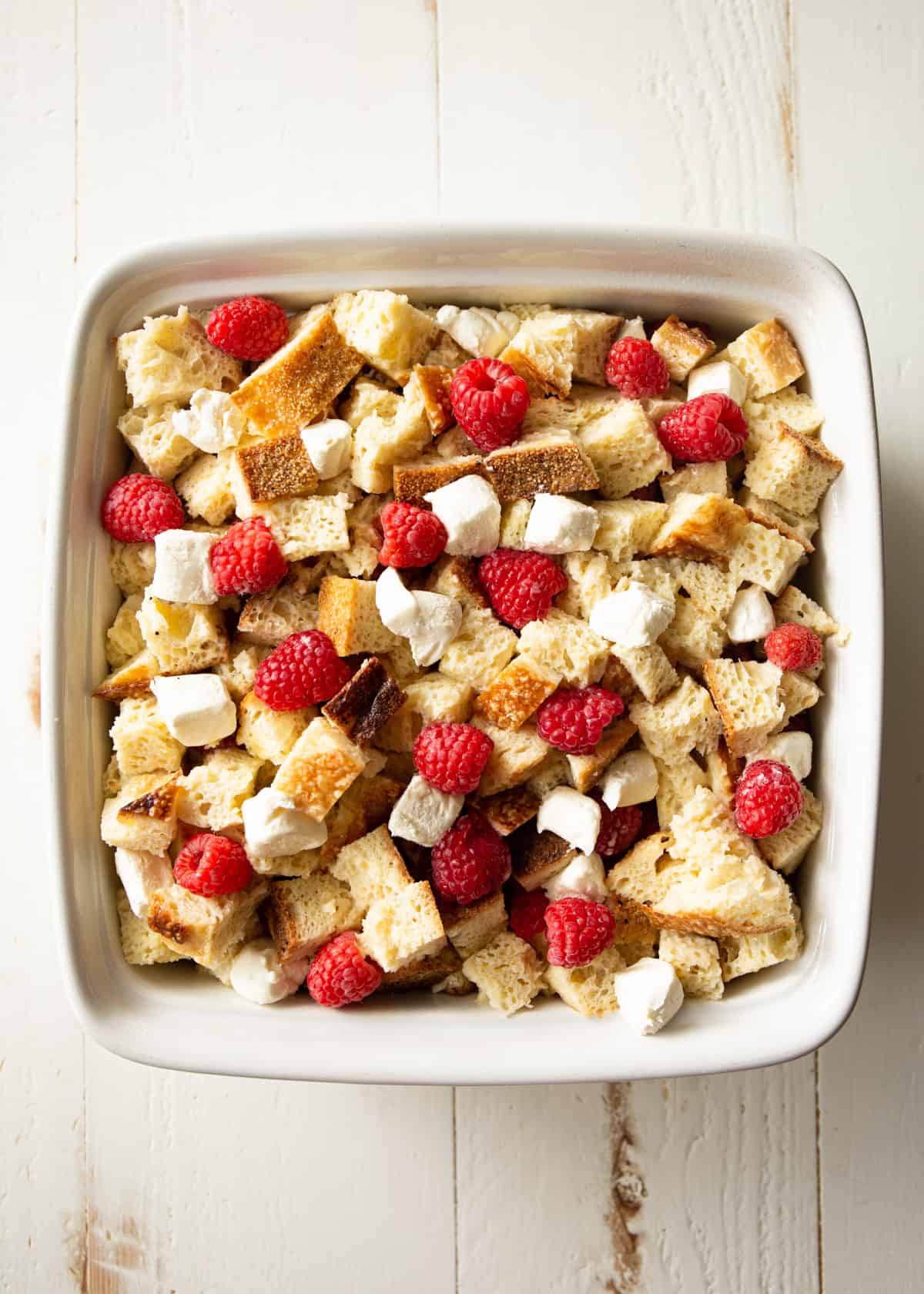 overhead image of french toast bake in a white baking dish