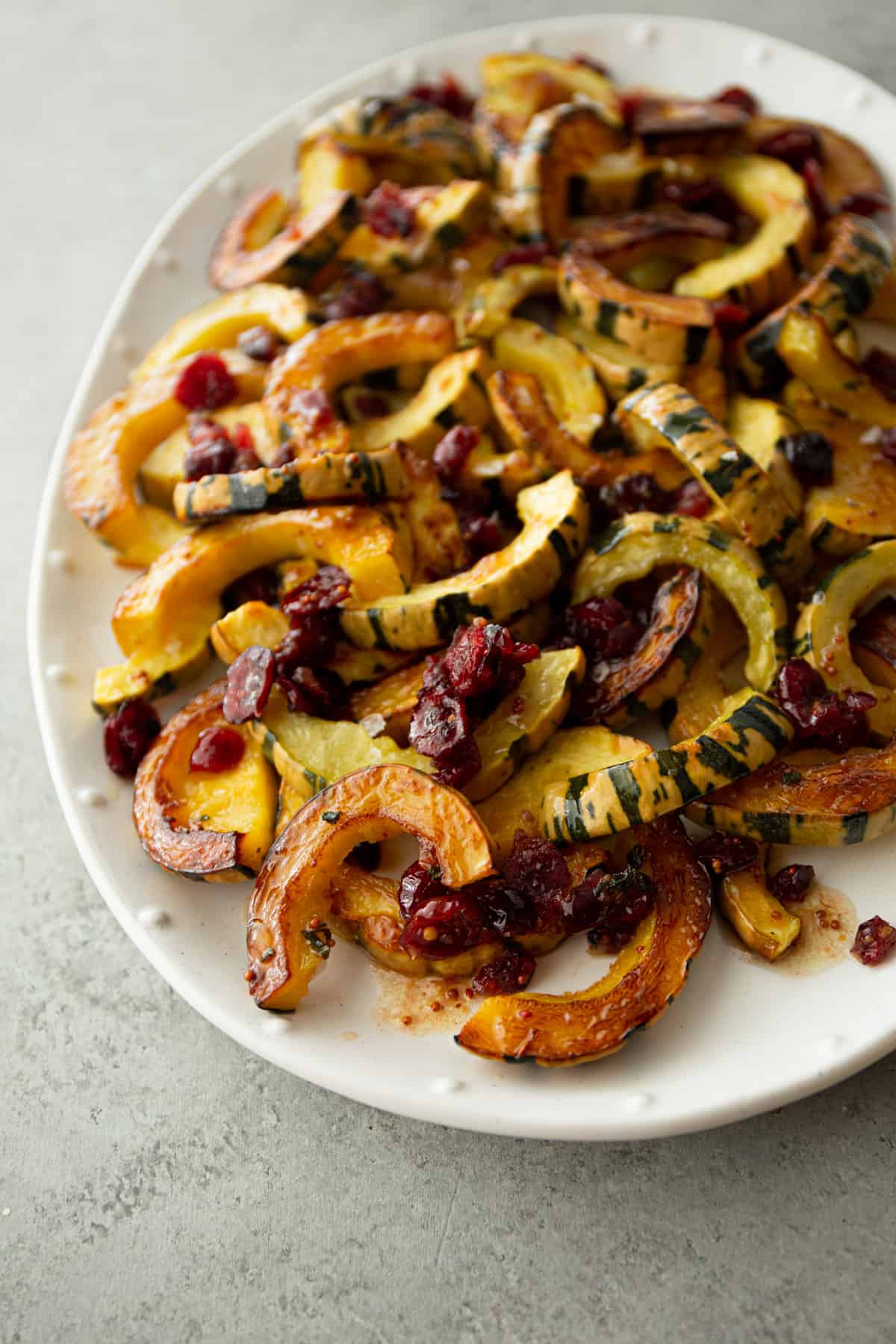 roasted delicata squash on a white tray