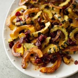 roasted delicata squash on a white tray