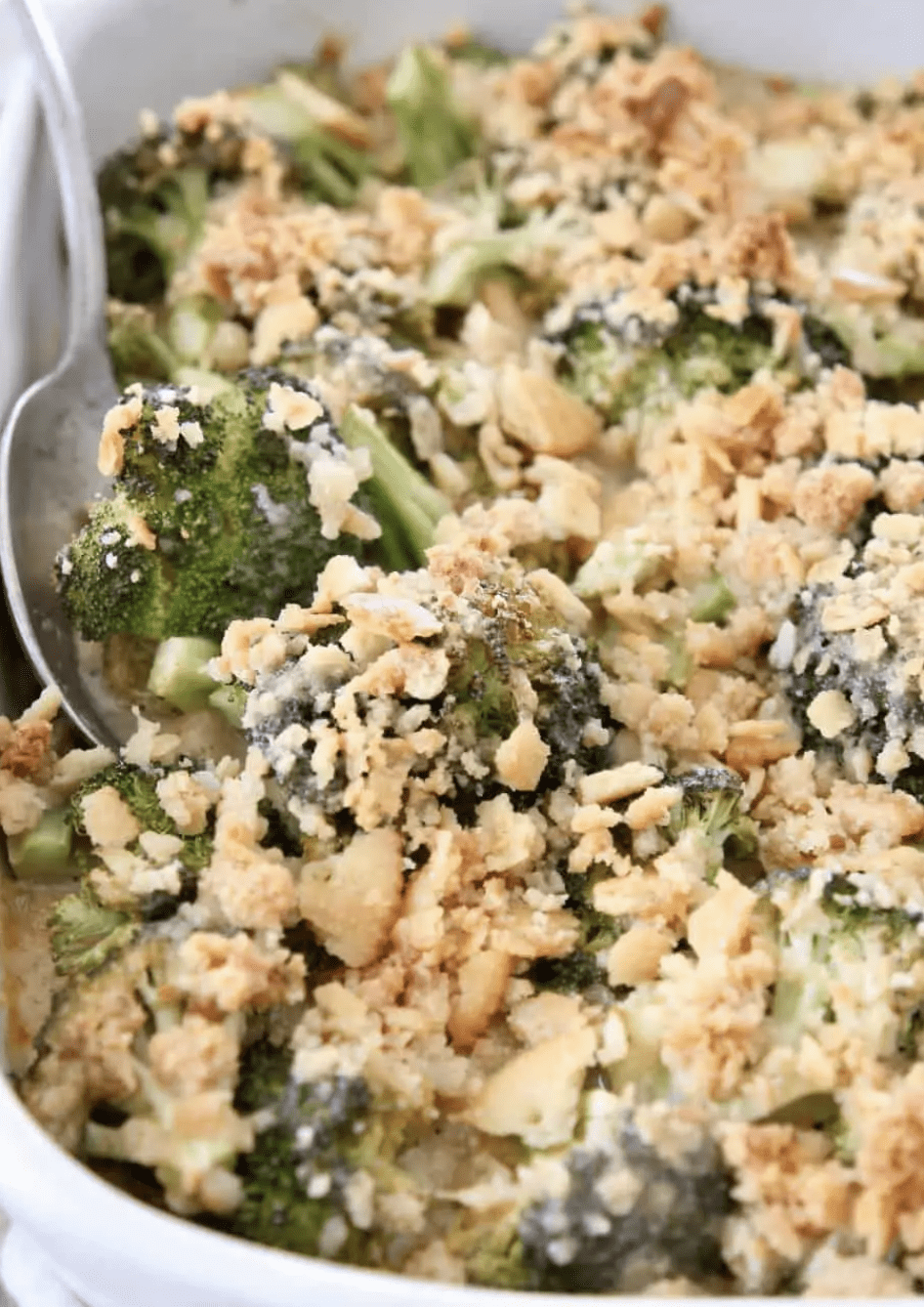 broccoli casserole in a white baking dish