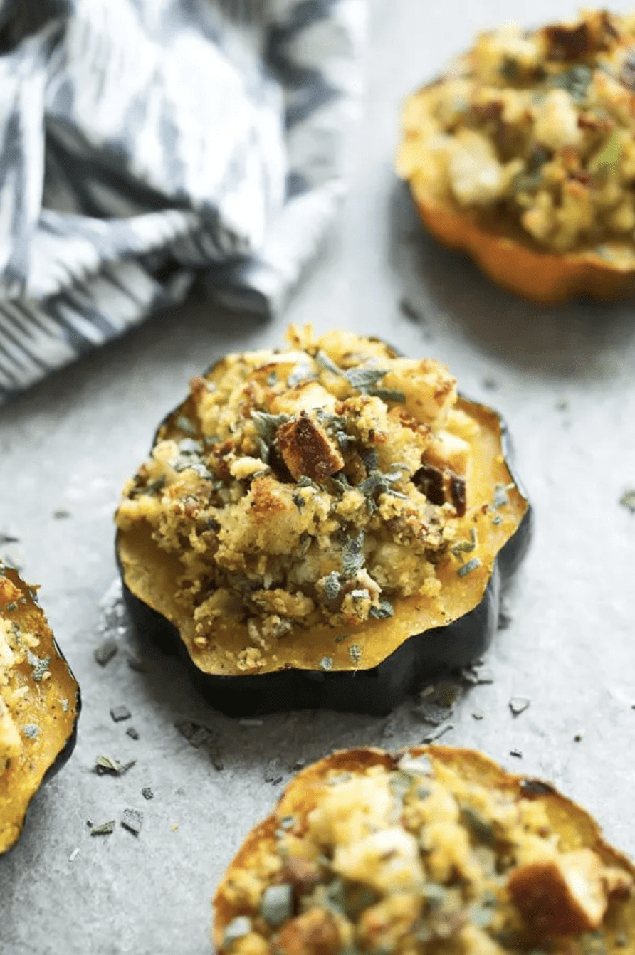 stuffed acorn squash on a white countertop