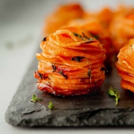 sweet potato stacks on a grey tray