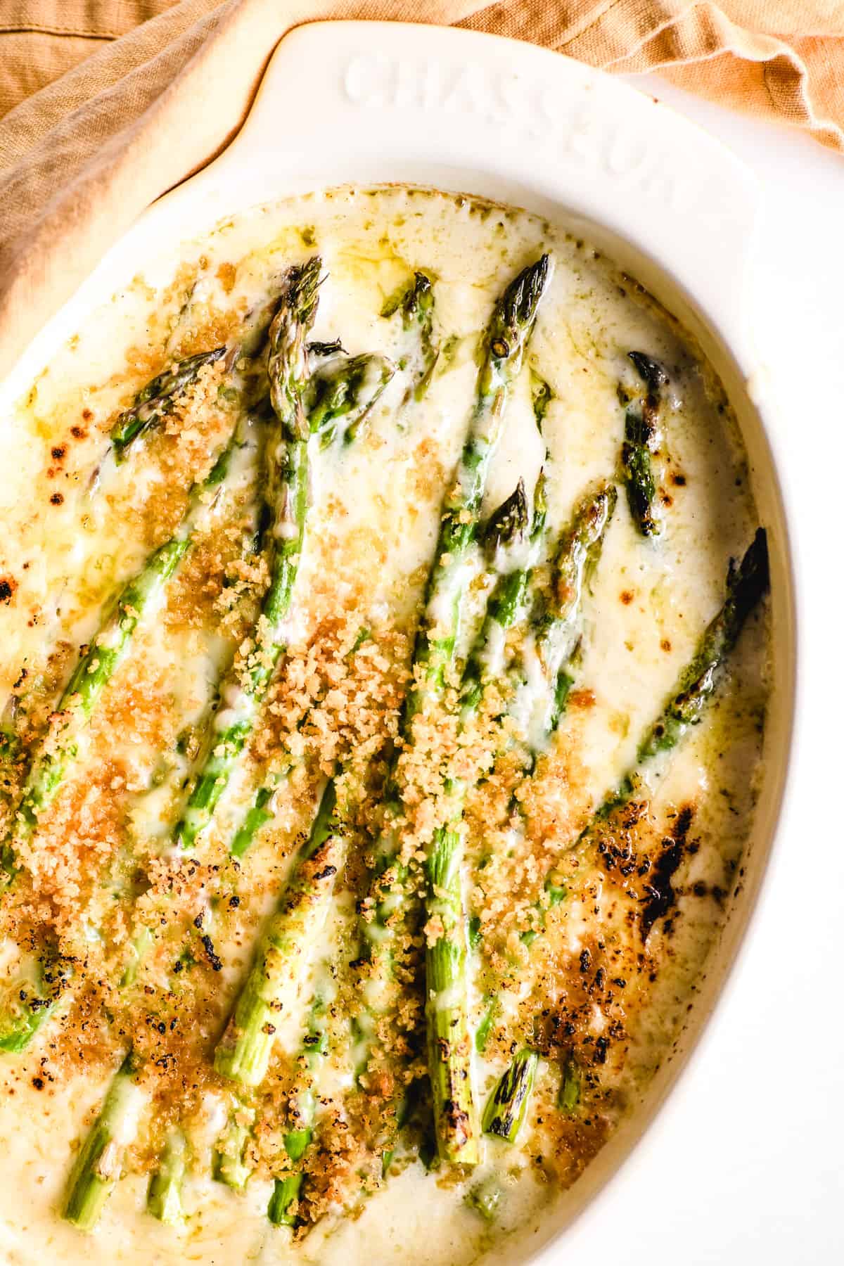 asparagus gratin in a white baking dish