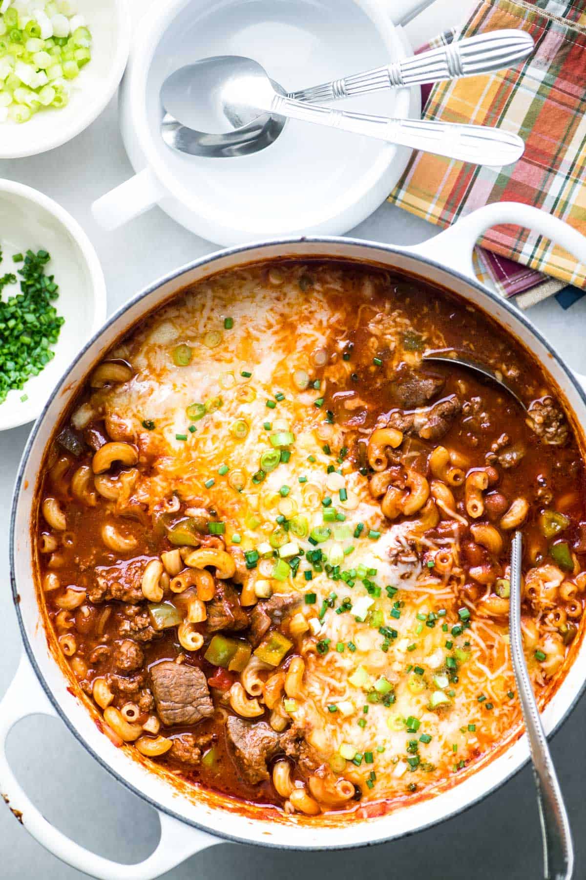 chili mac in a large white dutch oven