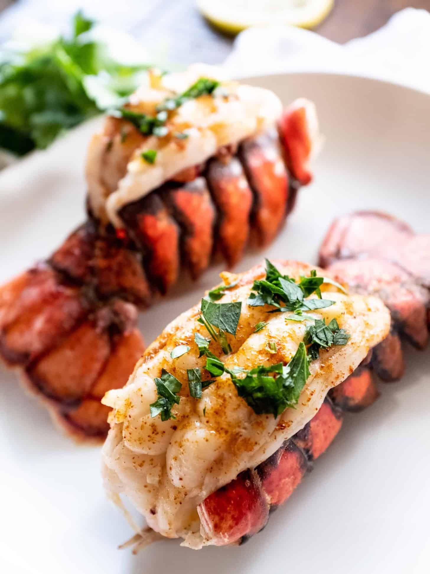 lobster tails on a white plate
