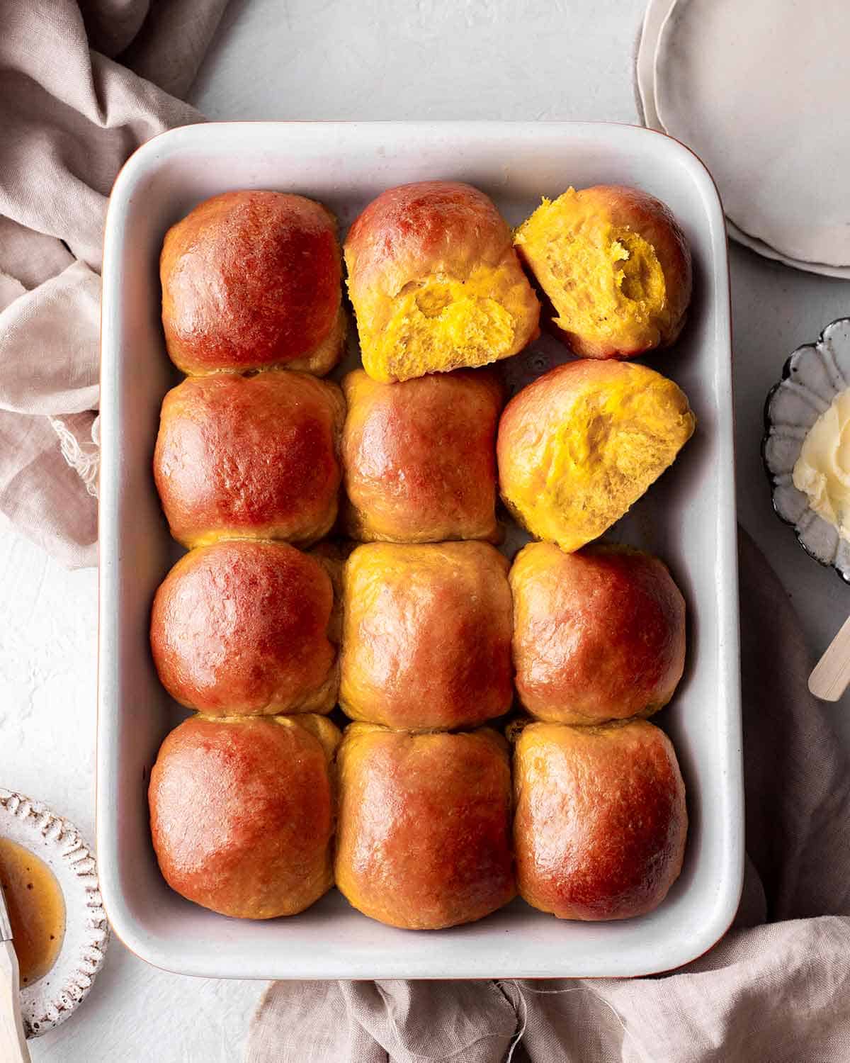 vegan dinner rolls in a white baking dish