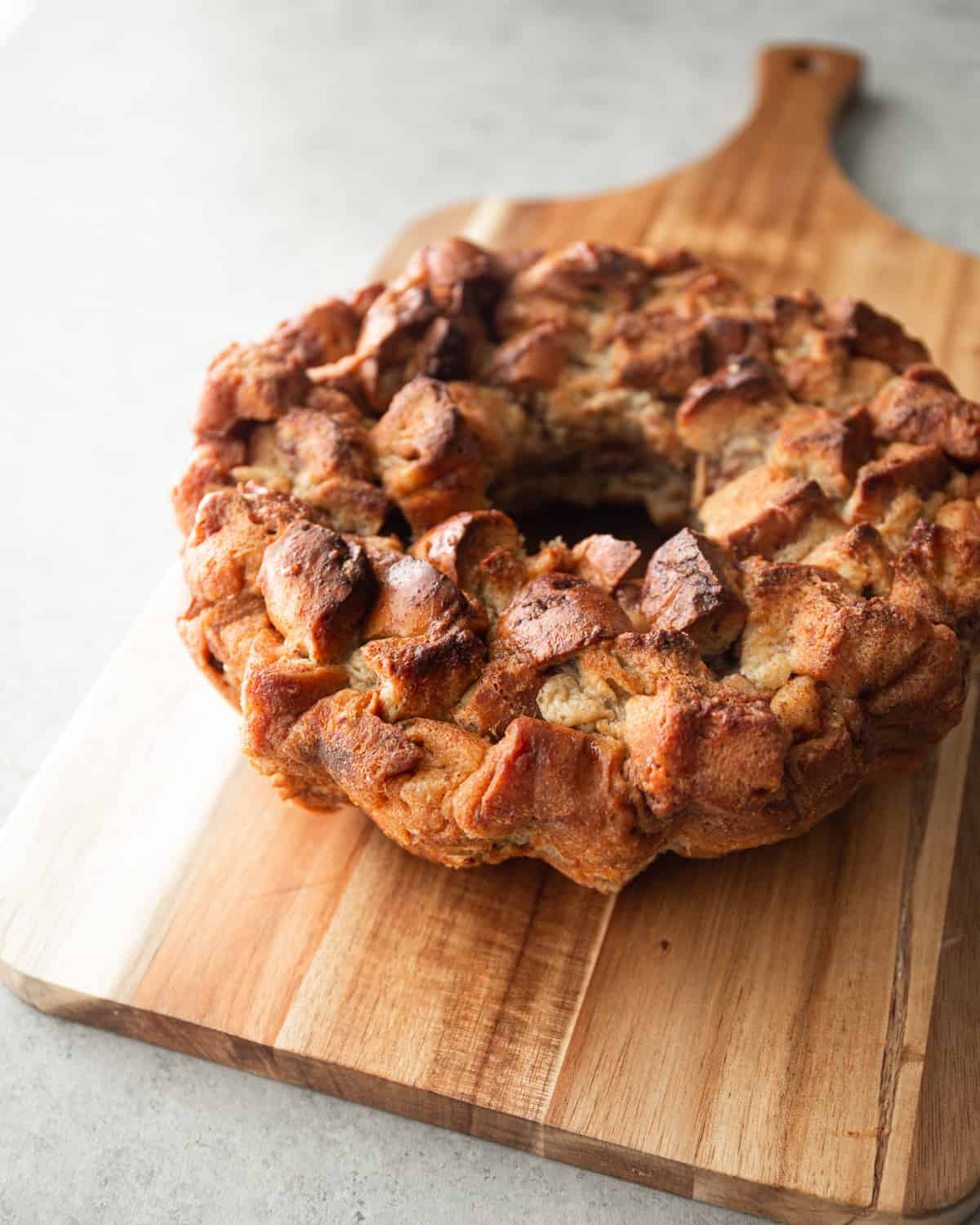 cinnamon bake on a wooden cutting board