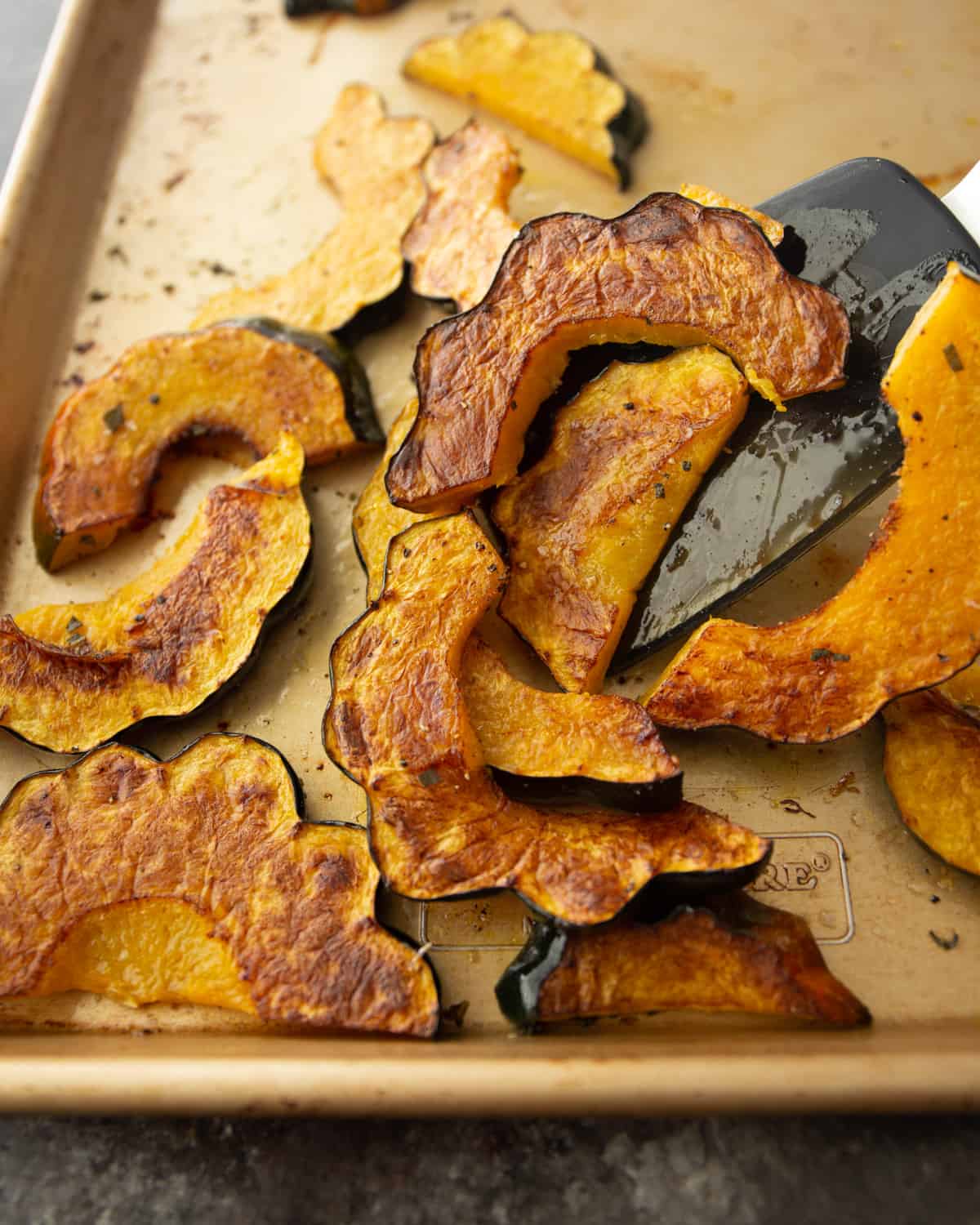 roasted acorn squash on a sheet pan