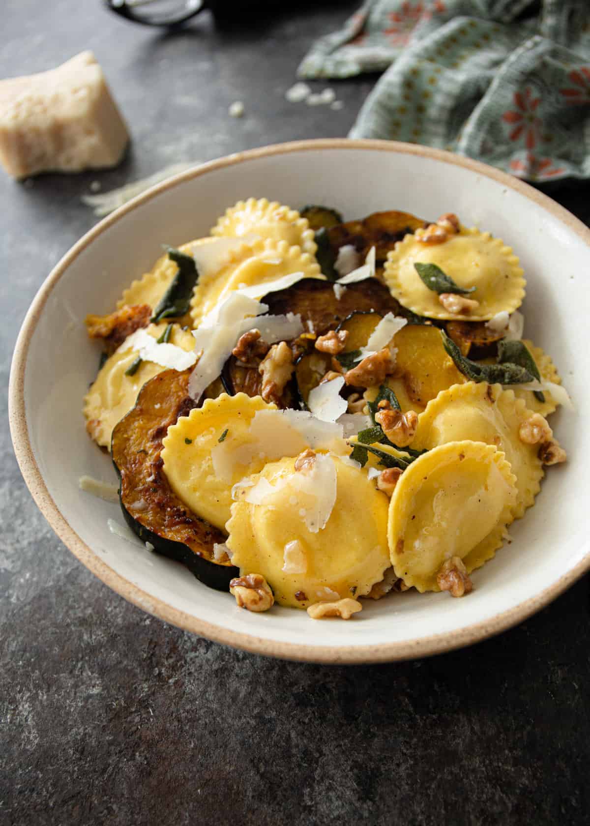 ravioli and squash in a white bowl