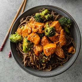 salmon and broccoli in a grey bowl