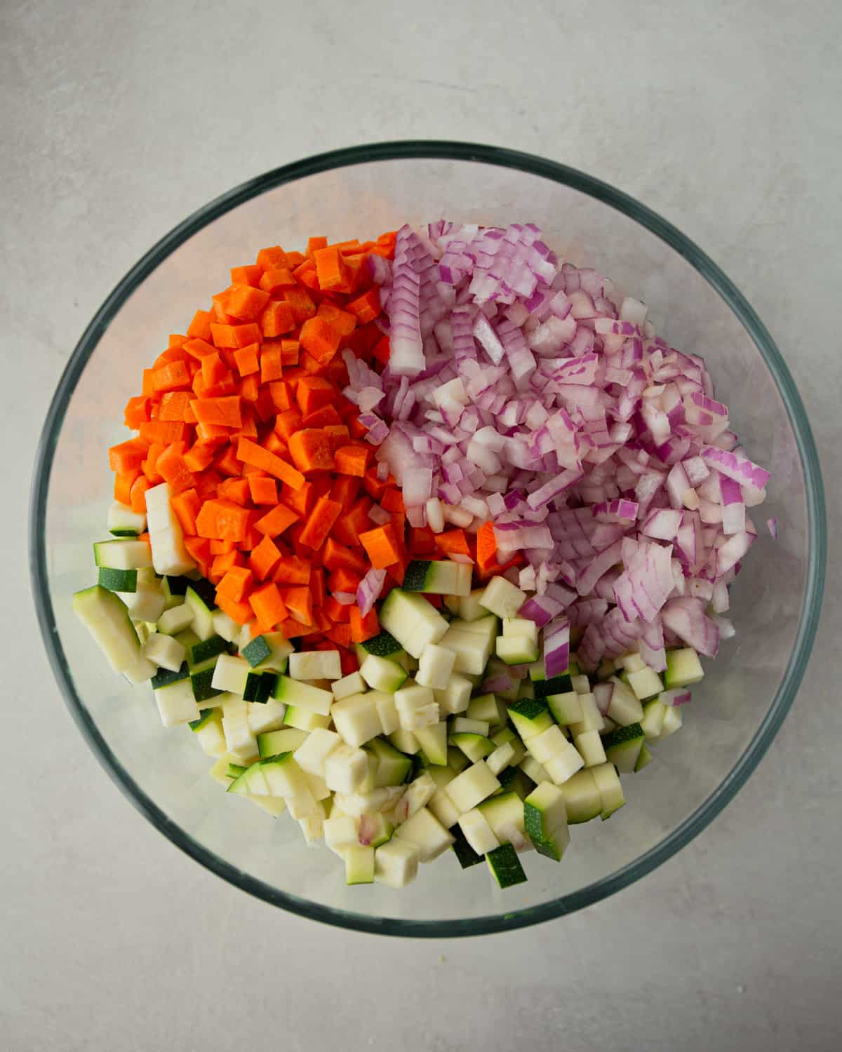 diced vegetables in a clear glass bowl
