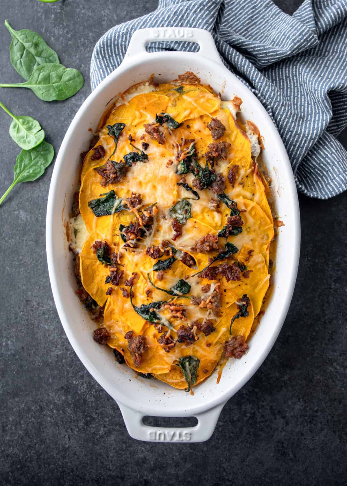 overhead image of butternut squash lasagna in a white baking dish