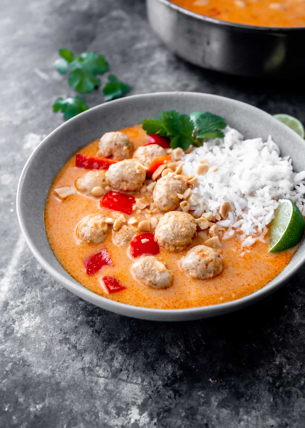 meatballs and curry in a grey bowl