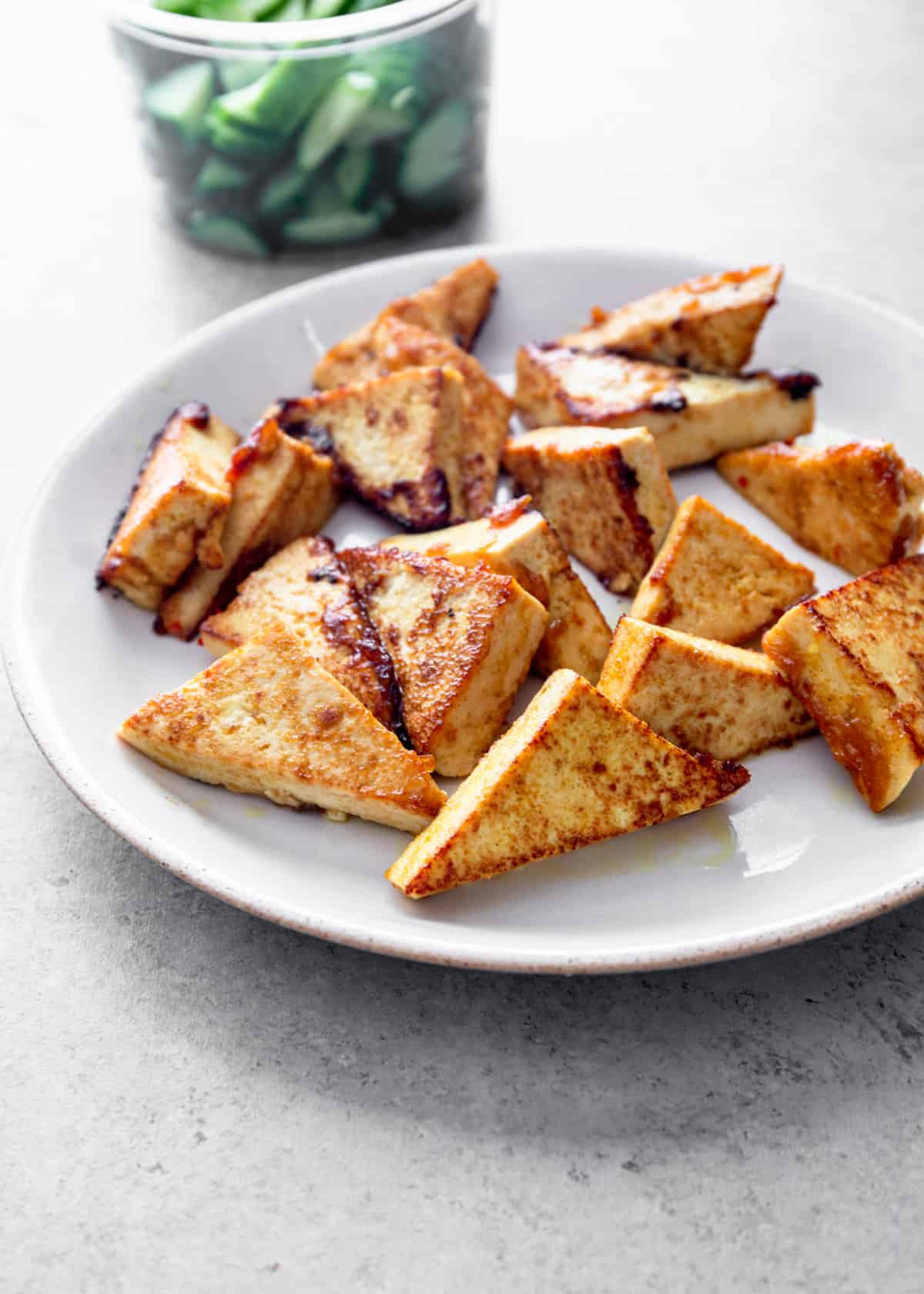 wedges of tofu on a white plate