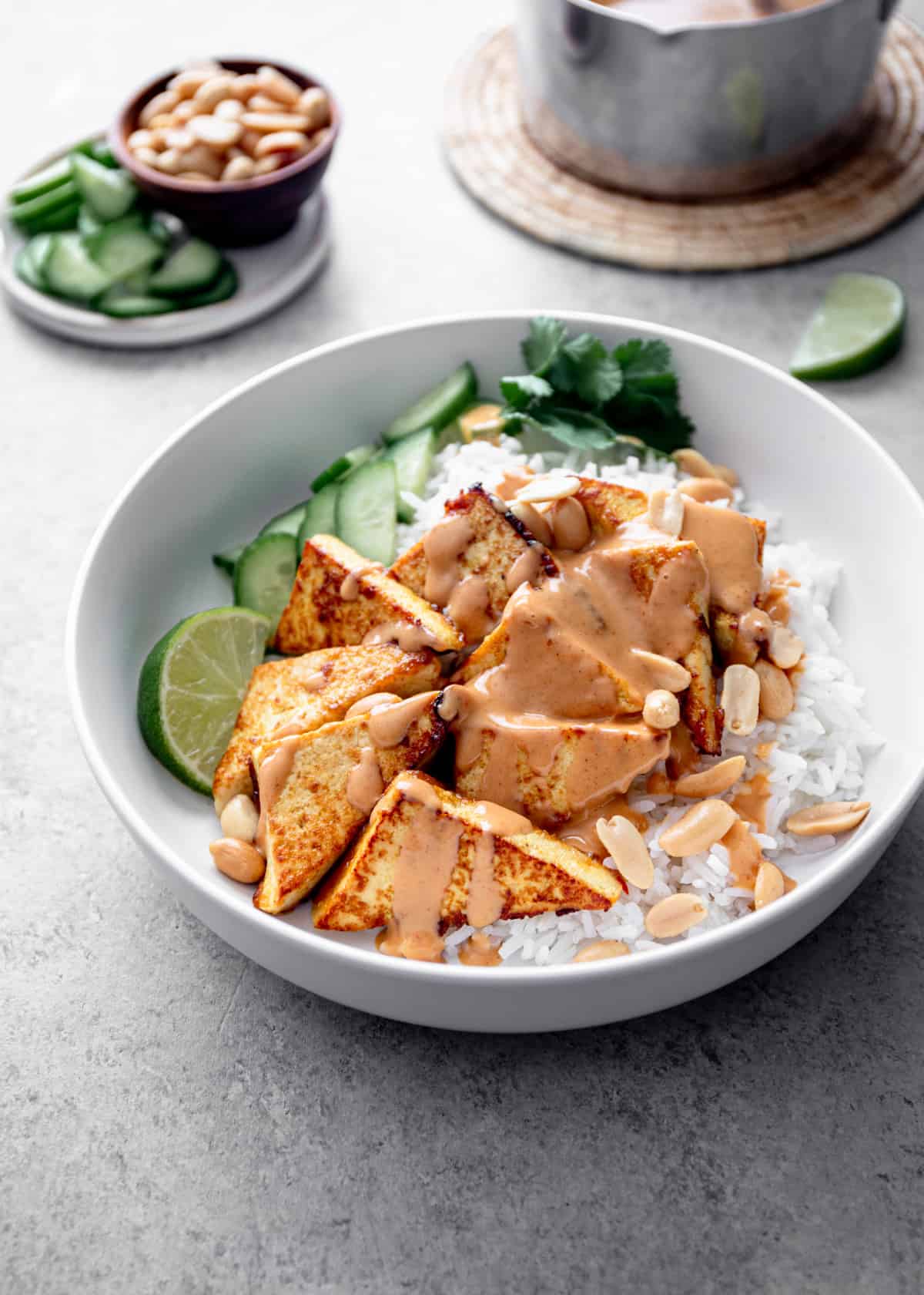 tofu over rice in a white bowl