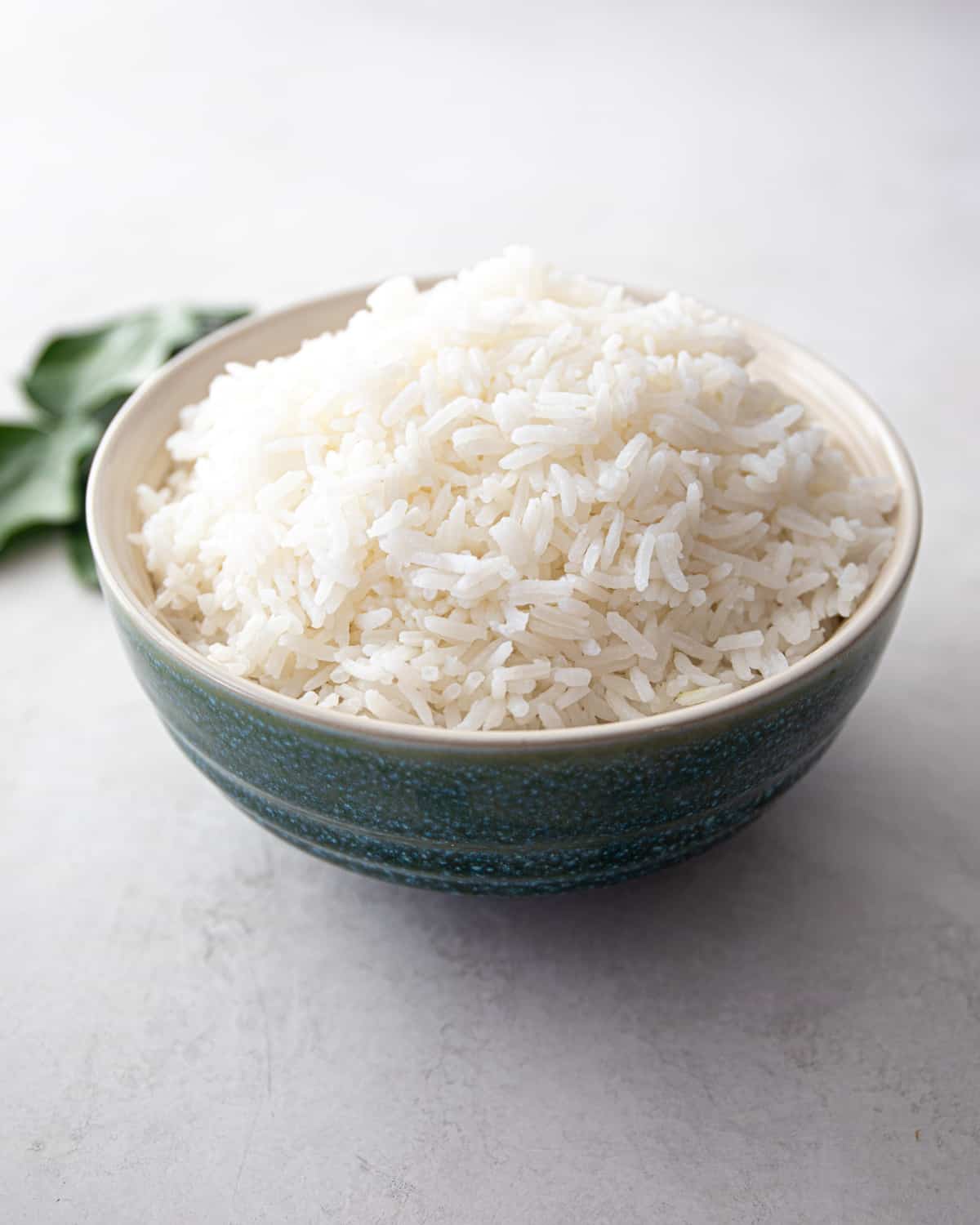coconut rice in a large blue bowl