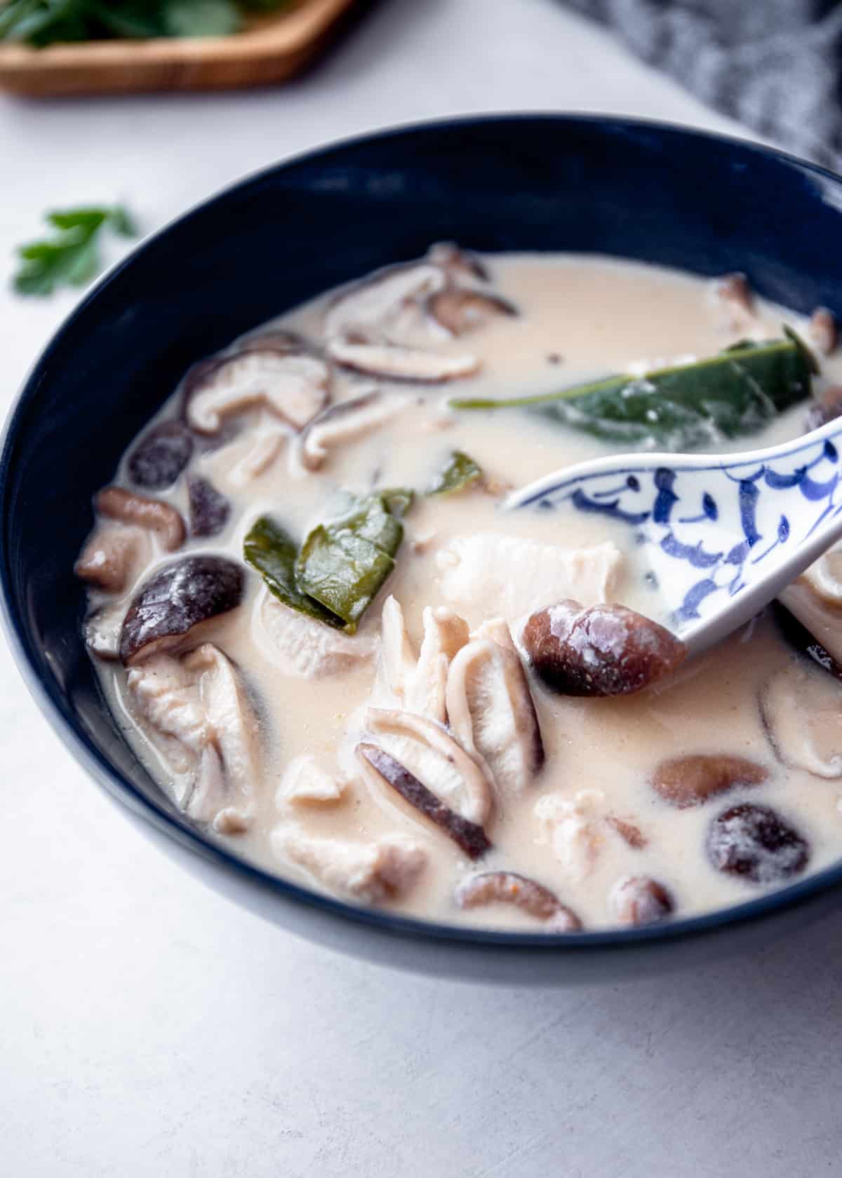 mushroom soup in a black bowl