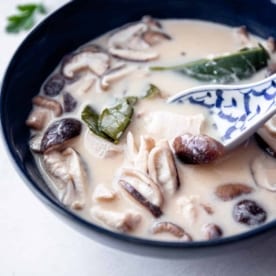 thai soup in a black bowl