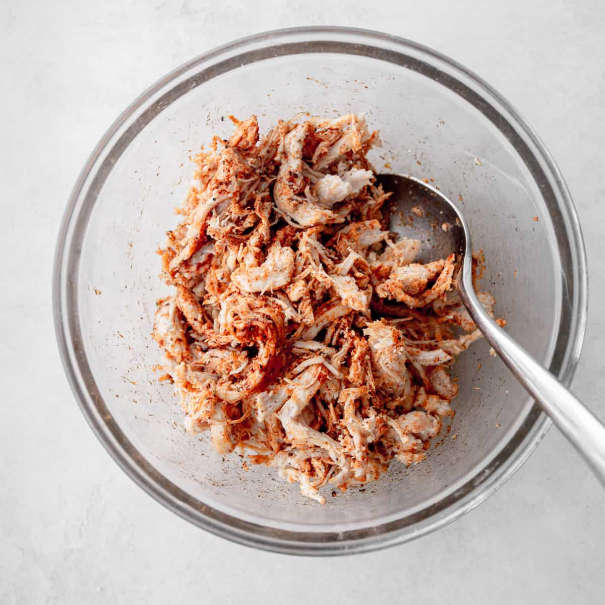 diced rotisserie chicken in a clear glass bowl