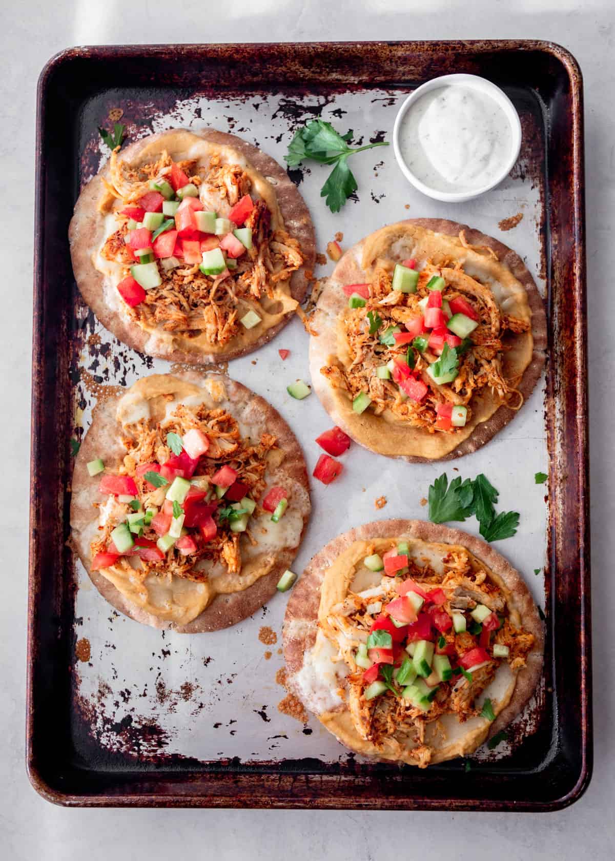 chicken flatbreads on a sheet pan