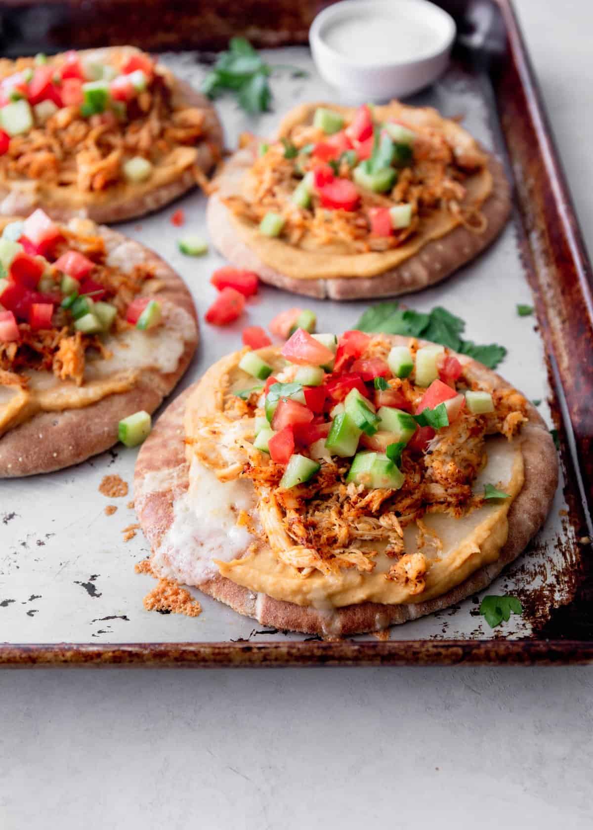 chicken flatbreads on a sheet pan