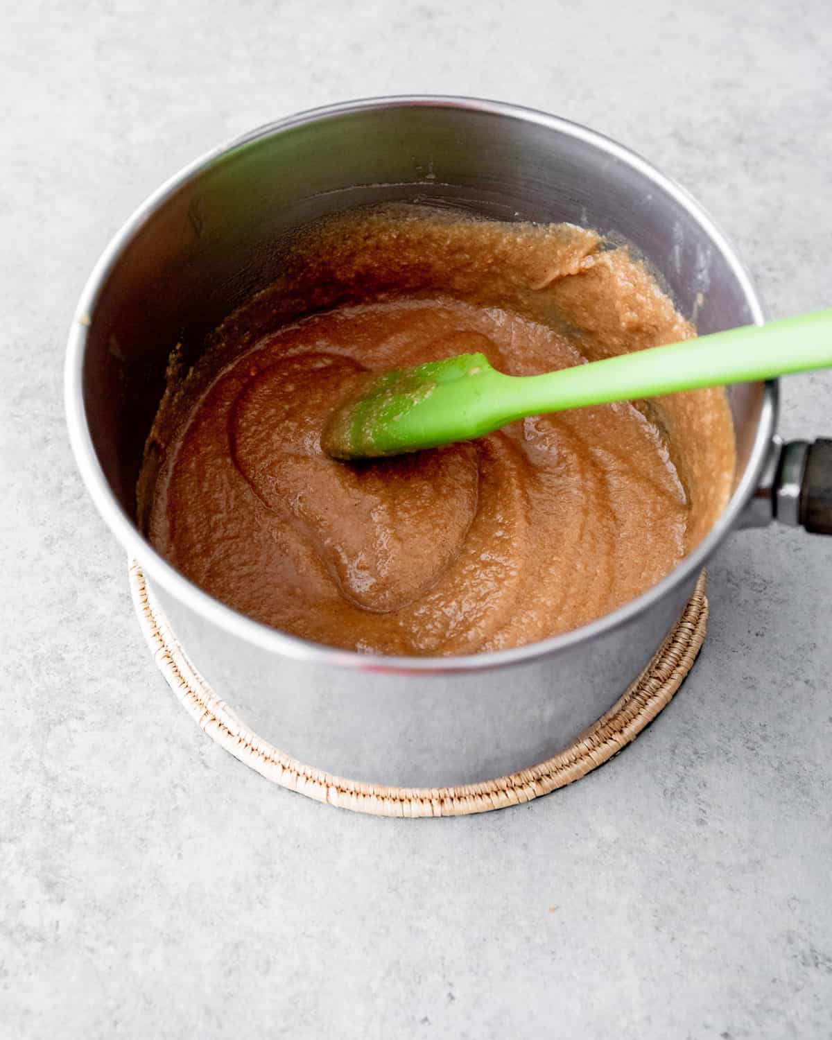 stirring peanut butter in a saucepan