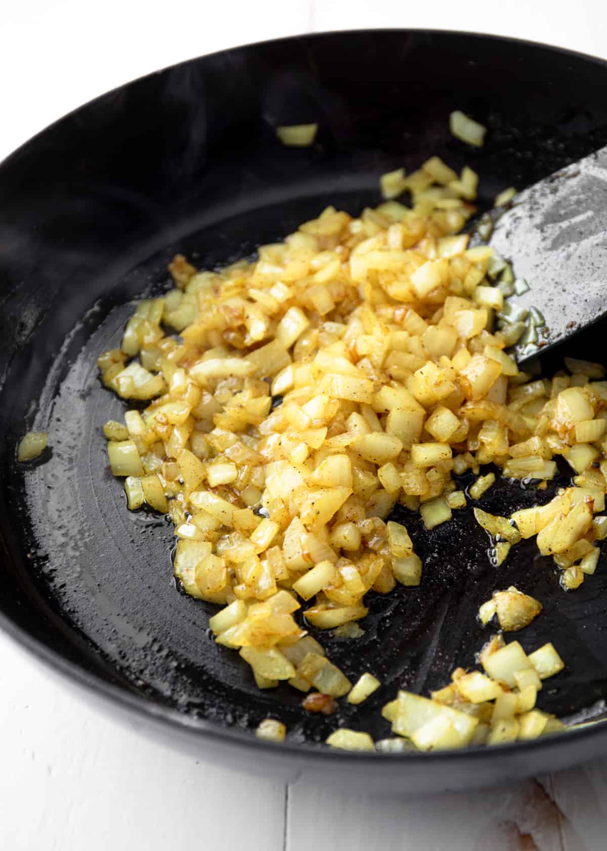 sauteeing onions in a cast iron skillet