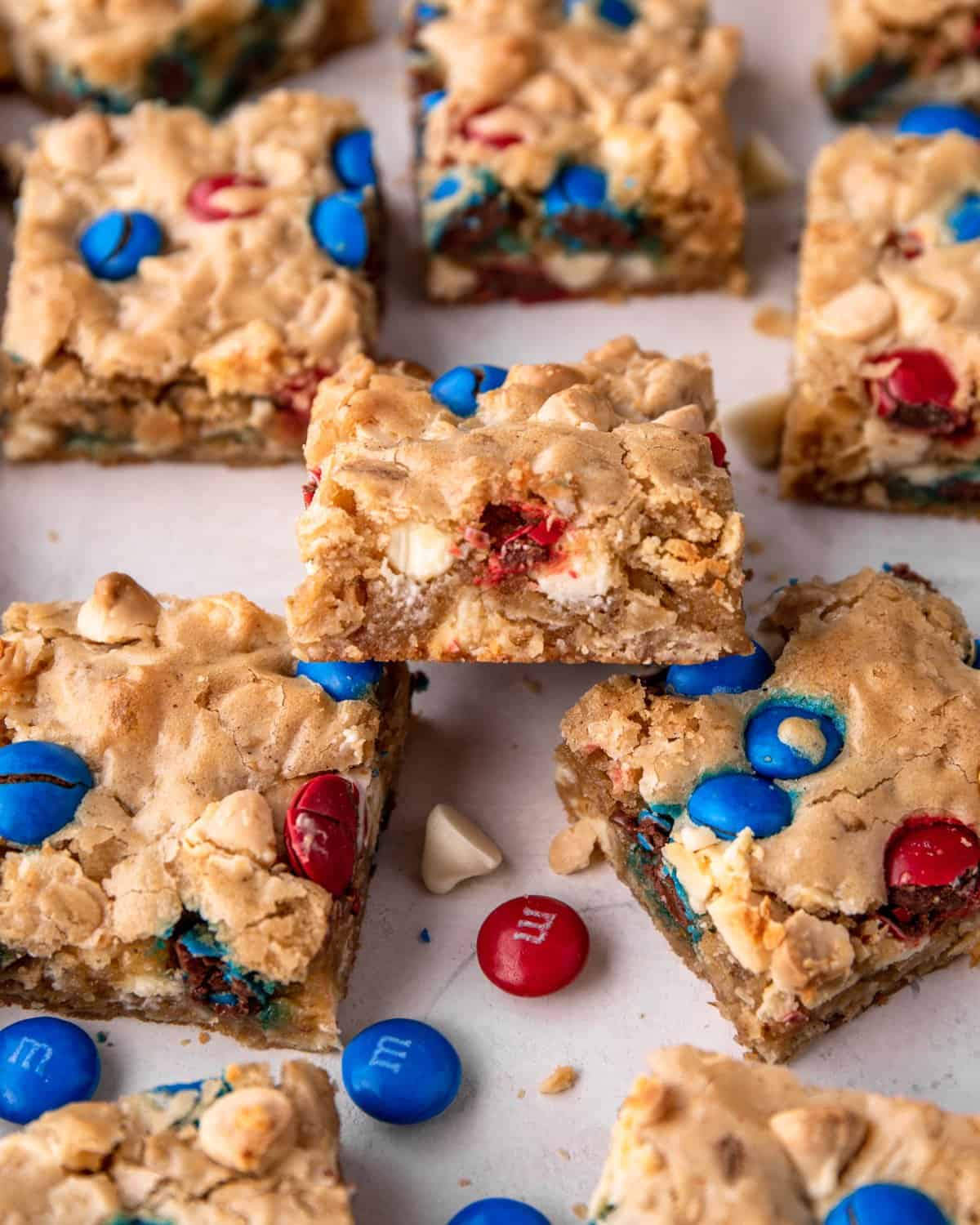 close up of cookie bars with red and blue candies