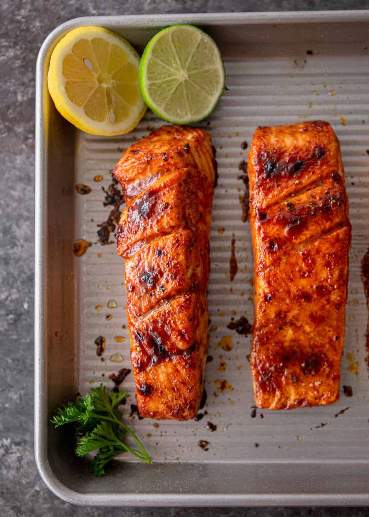 broiled salmon on a metal sheet pan