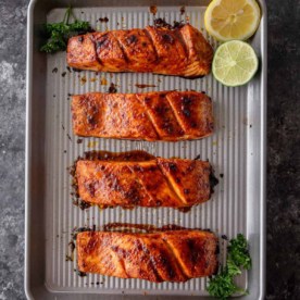 broiled salmon on a metal sheet pan