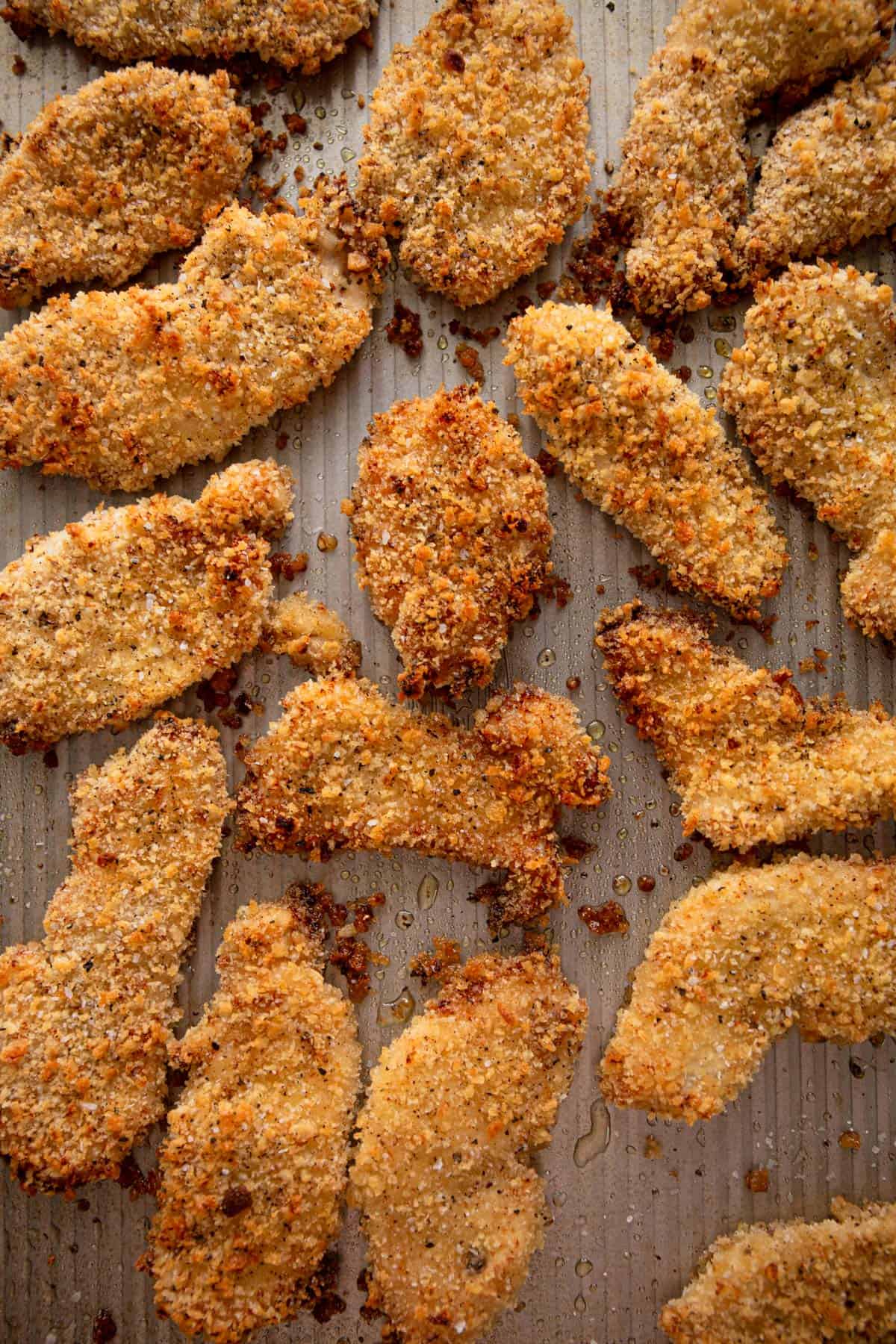 crispy chicken tenders on a sheet pan