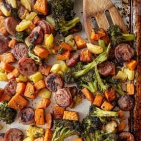 roasted vegetables and sausage on a sheet pan