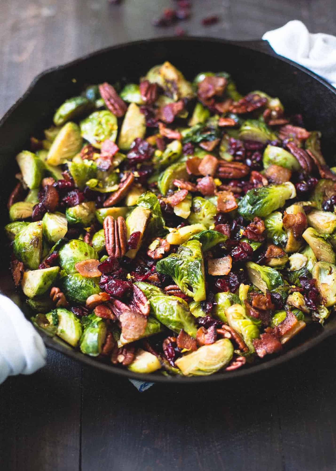 brussels sprouts, bacon and pecans in a cast iron skillet