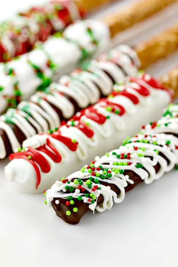 white chocolate covered pretzels with red and green sprinkles