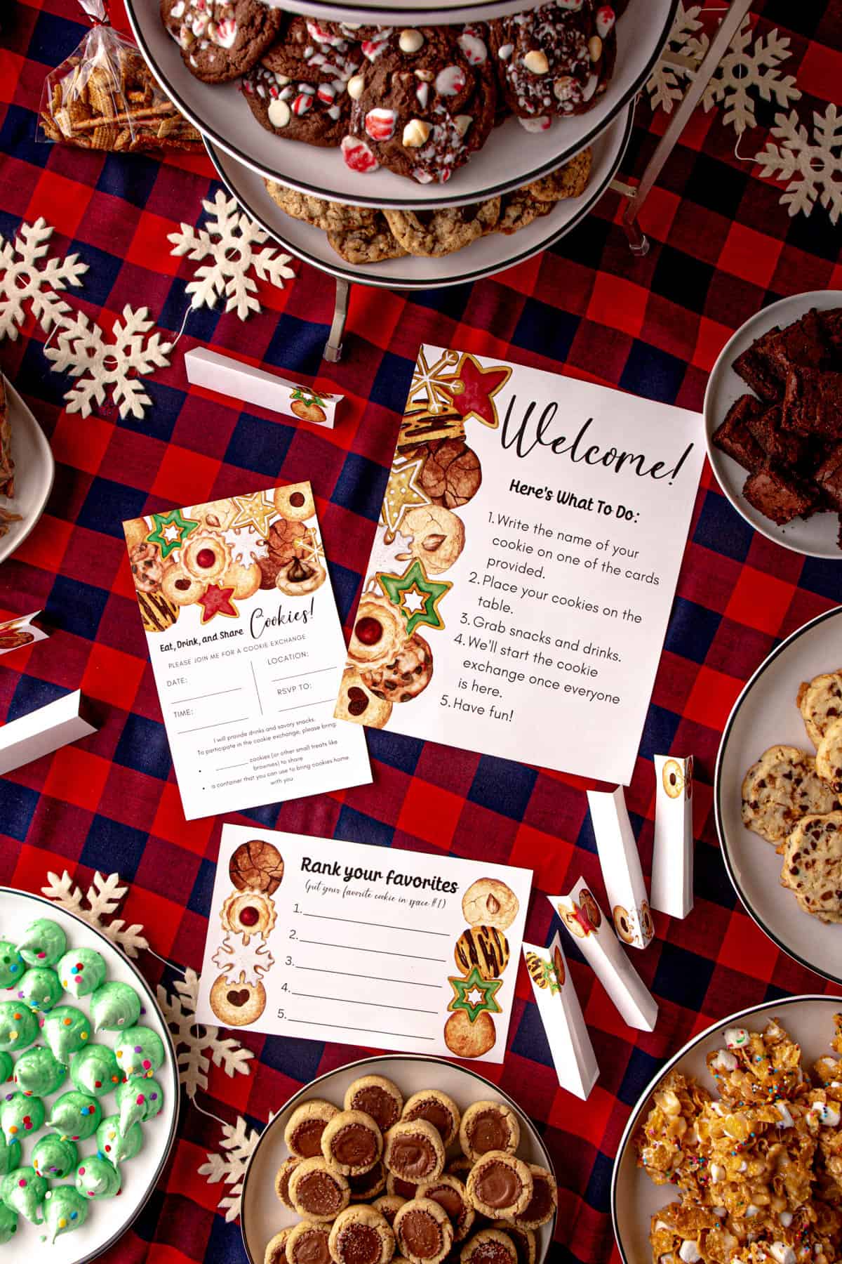 printable cards and plates of Christmas cookies on a plaid tablecloth 