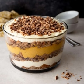 pumpkin spice trifle in a clear glass trifle bowl