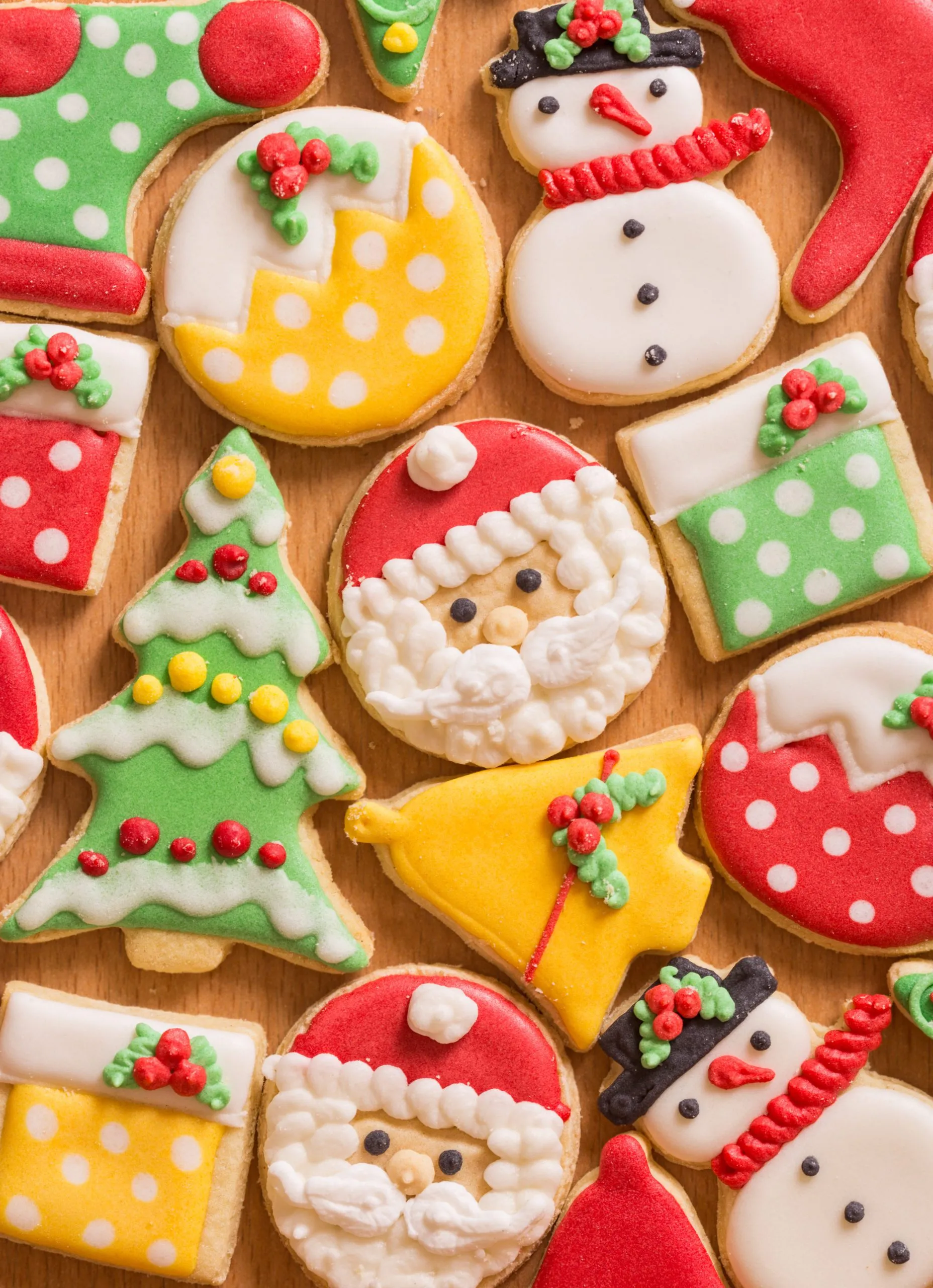 christmas sugar cookies on a wooden cutting board